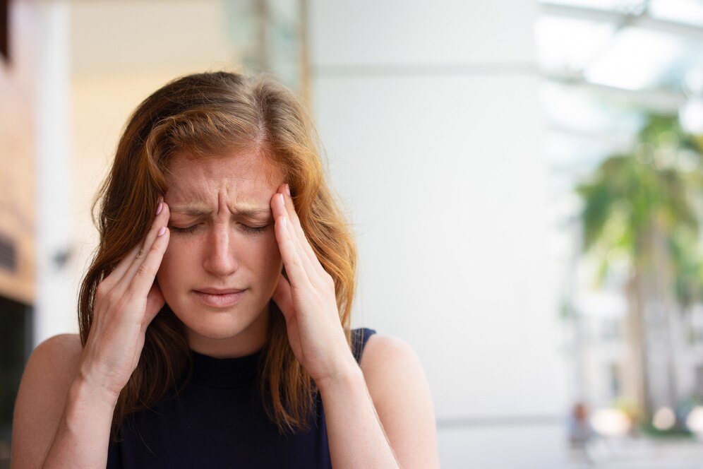 exhausted-office-worker-suffering-from-headache